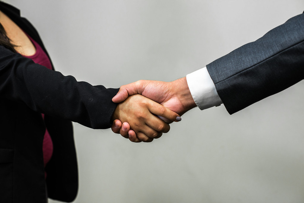 Handshake between accountant and business owner